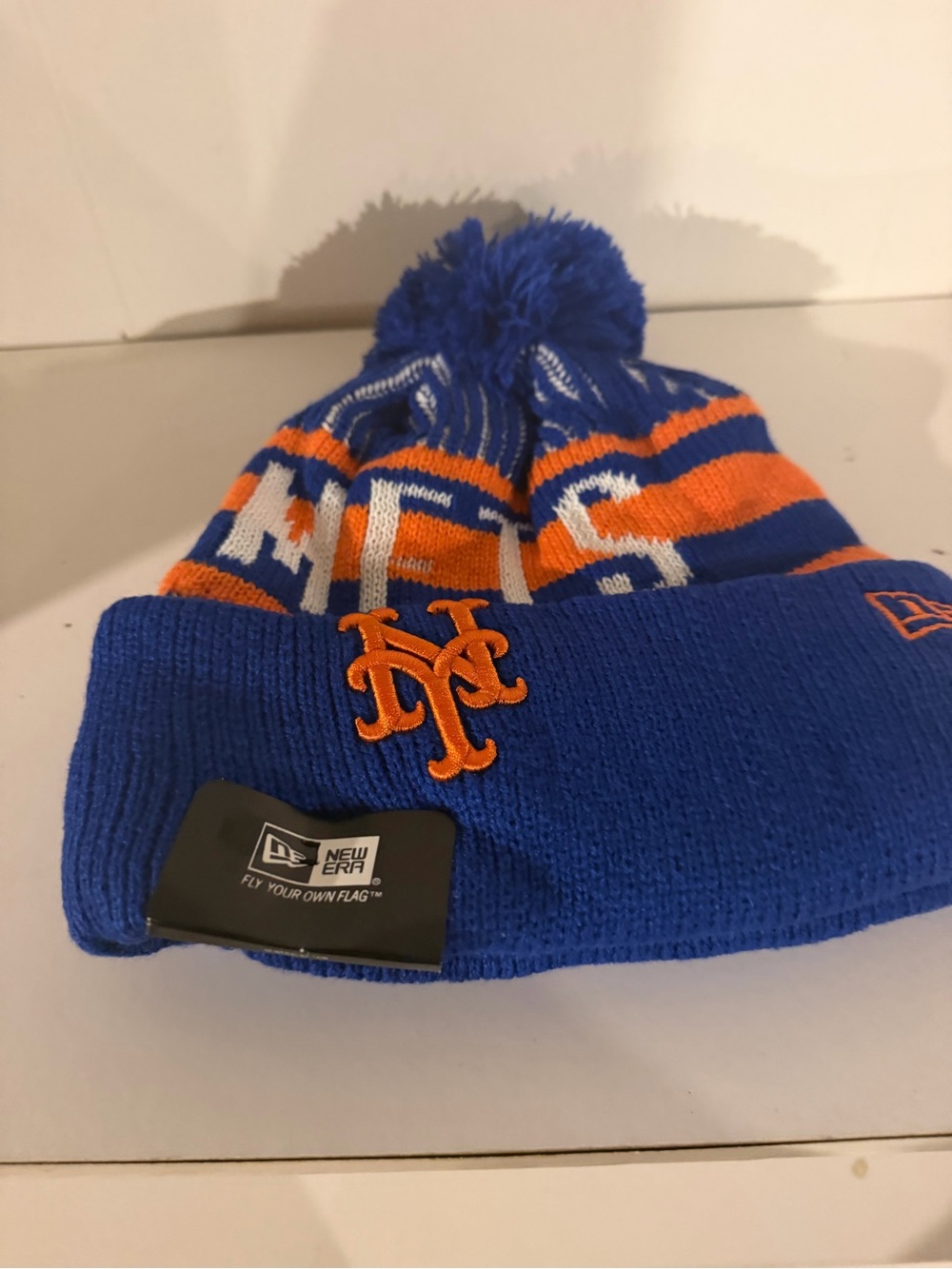 New Era adult  Pom Beanie — Royal Blue & Orange Mets Emblem